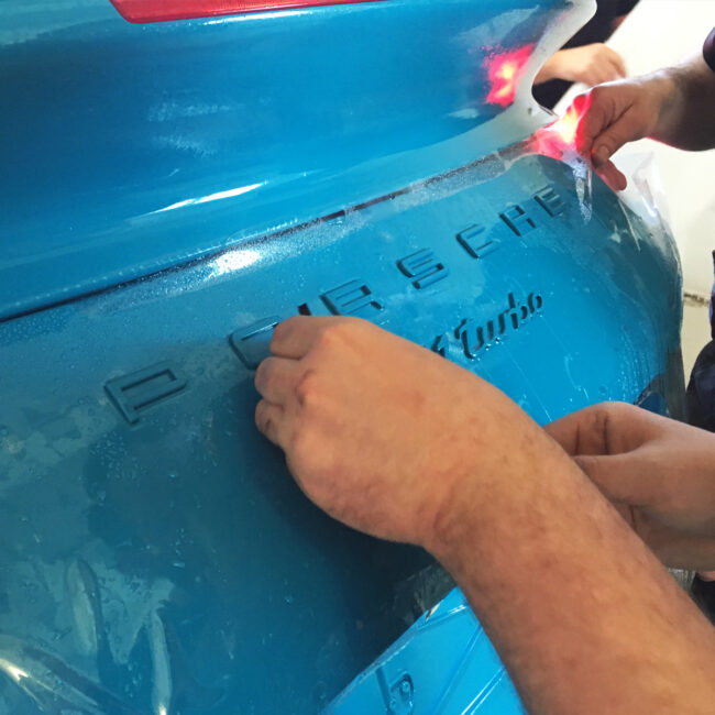 glos being applied to a porsche