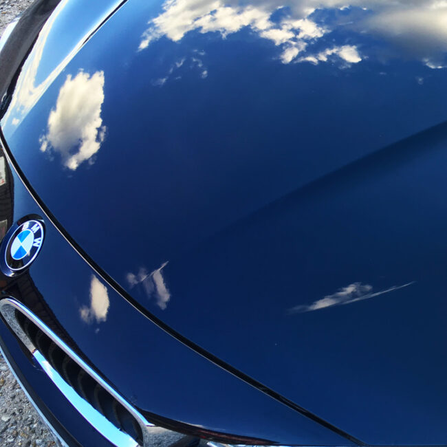 sky reflected on a glos protected bmw bonnet