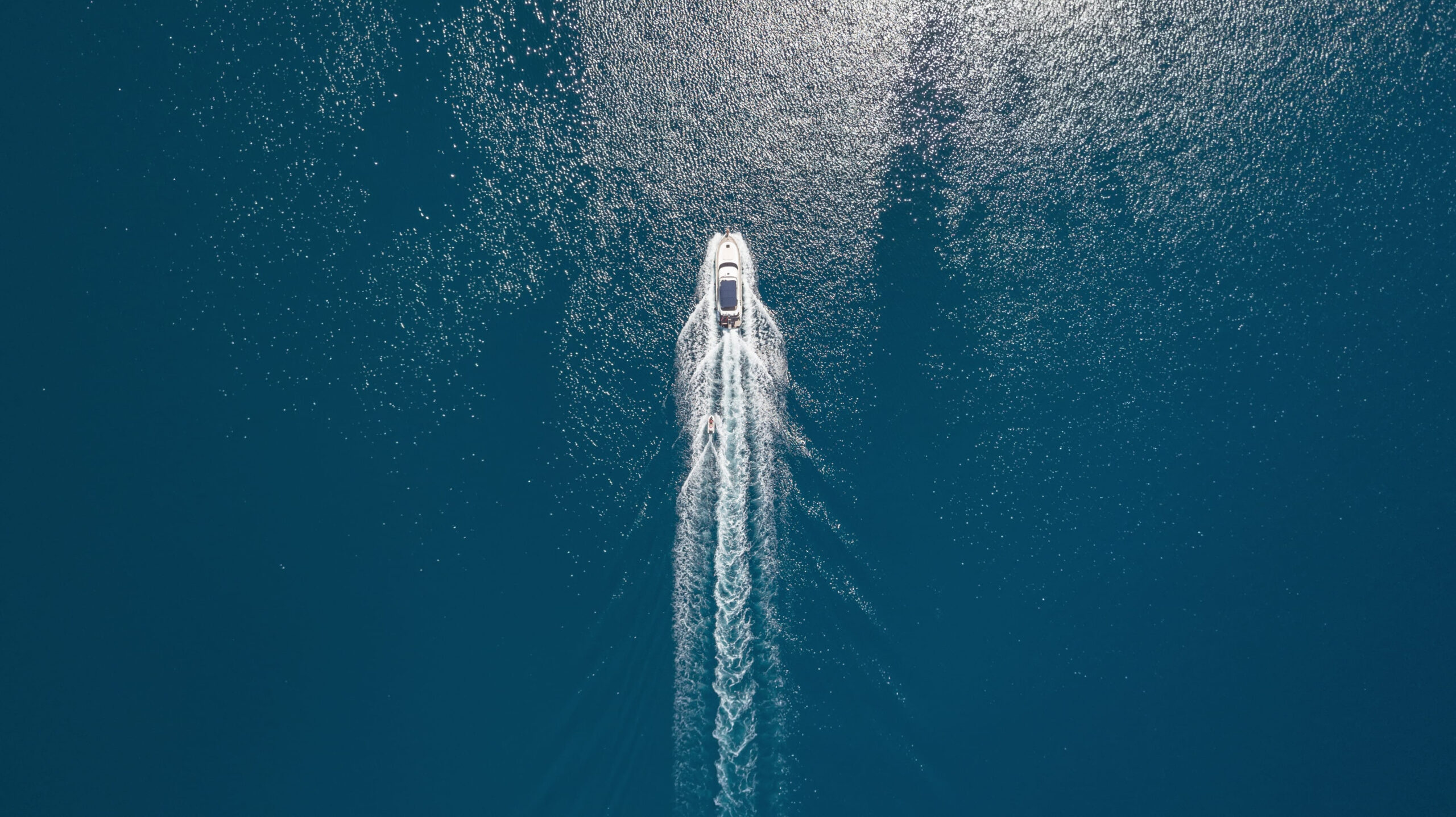 yacht and jetski seen from above