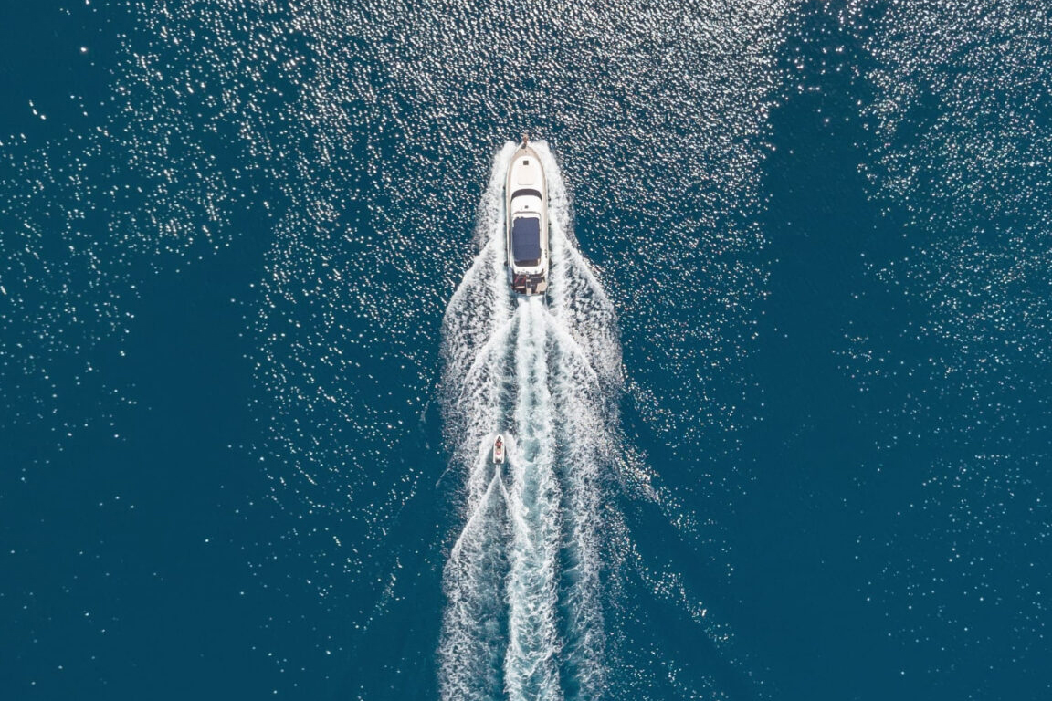 boat travelling north on the open sea